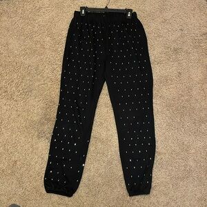 Black Adika sweats with jewels on them size Medium.